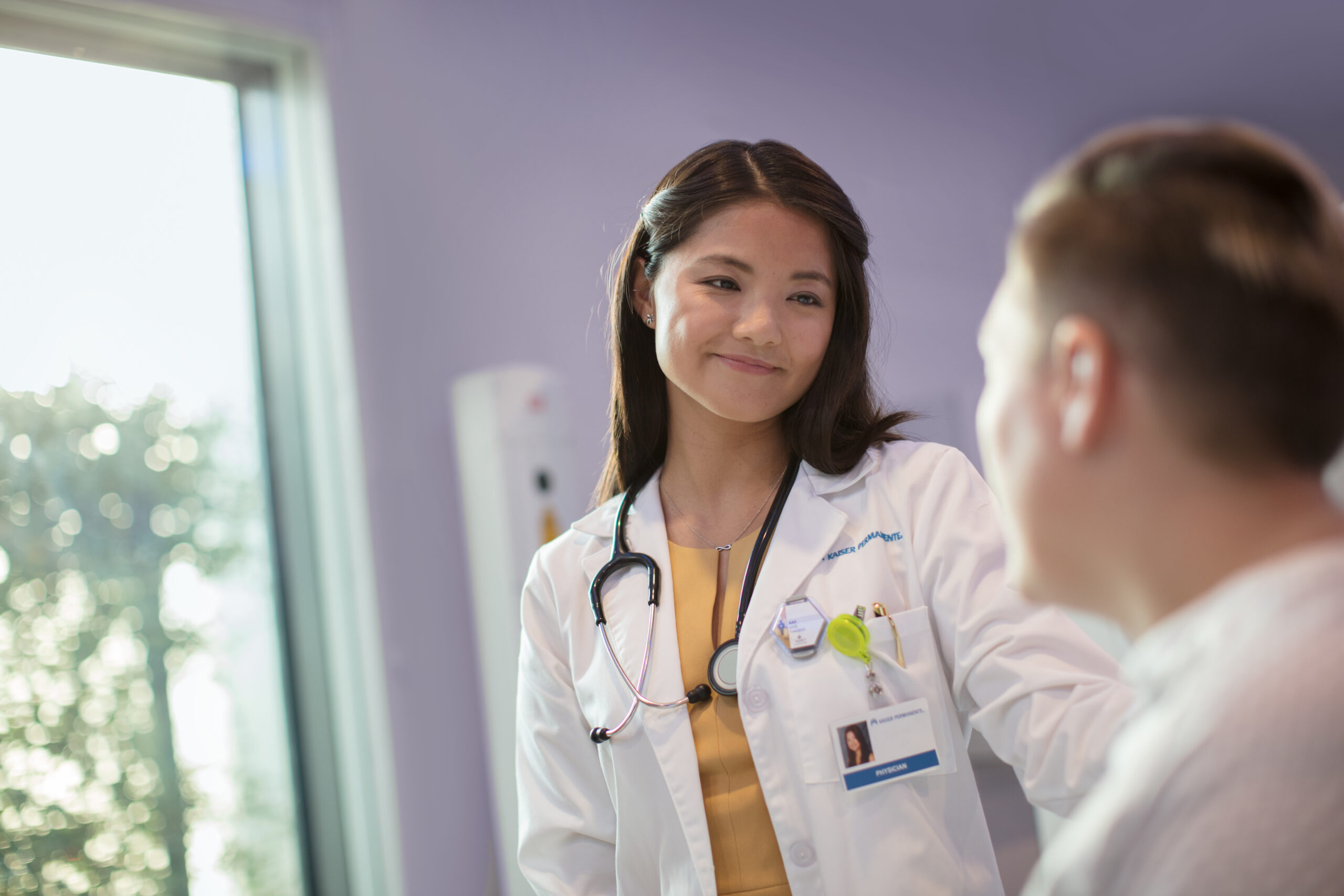 Doctor with patient in exam room