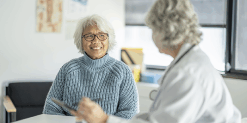 Older adult with care team member